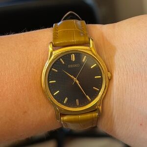 Seiko V701-A100 Black Dial Gold Toned Watch- Unisex